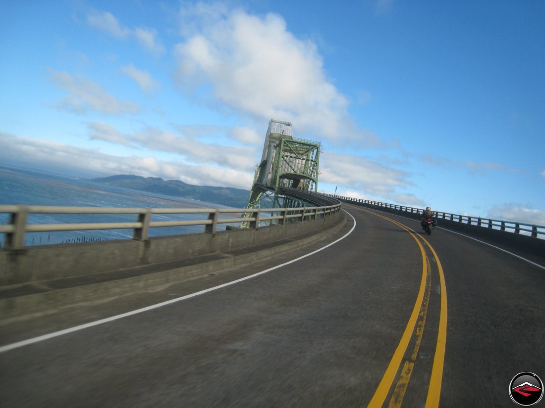 Riding a ducati motorcycle over the Meigler Bridge in Astoria, Oregon