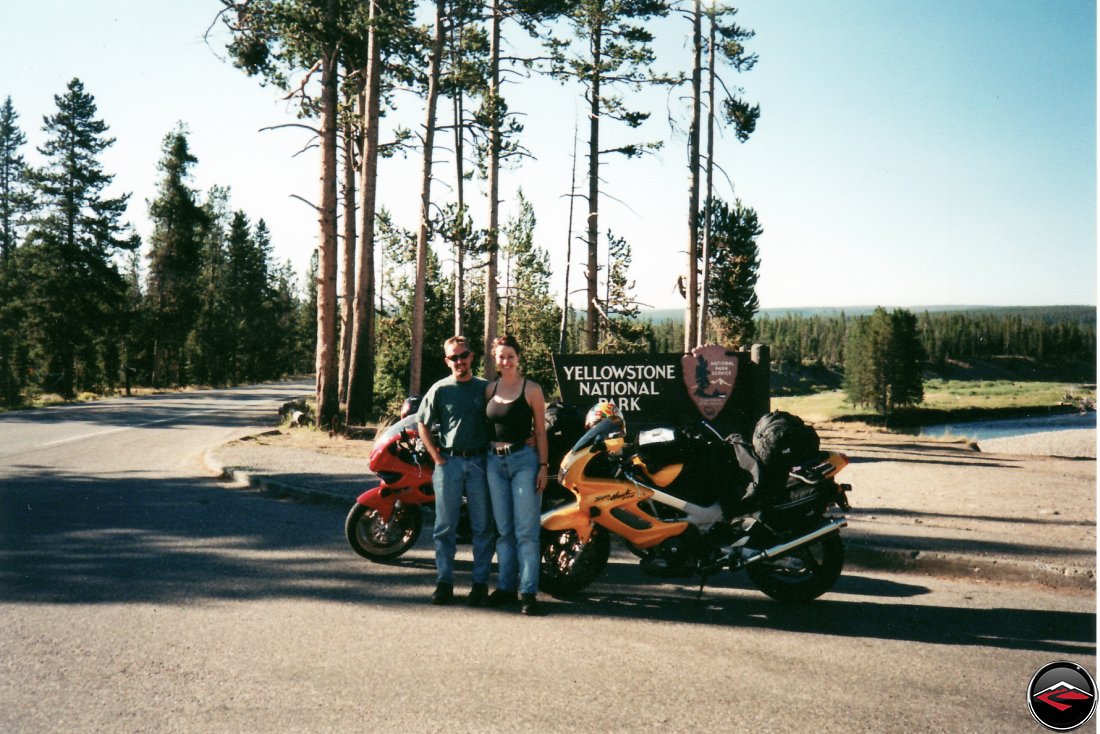 TL1000S and Honda Superhawk motorcycles at the Welcome to Yellowstone National Park sign