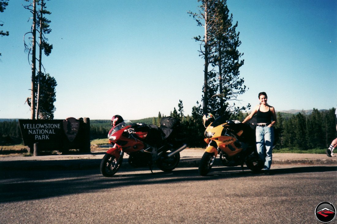 TL1000S and Honda Superhawk motorcycles and a sexy girl at the entering yellowstone national park sign