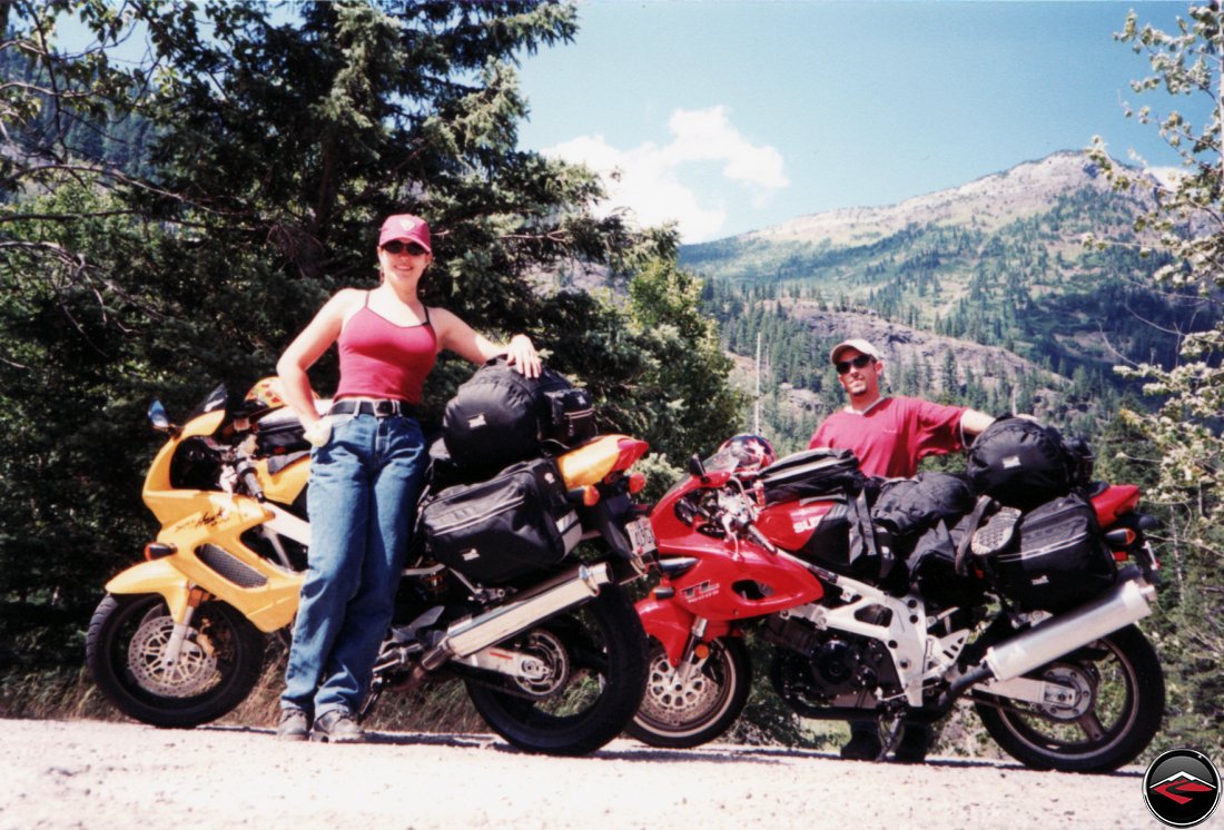 sexy girl and TL1000S and Honda Superhawk motorcycles taking a quick break on avalanche river