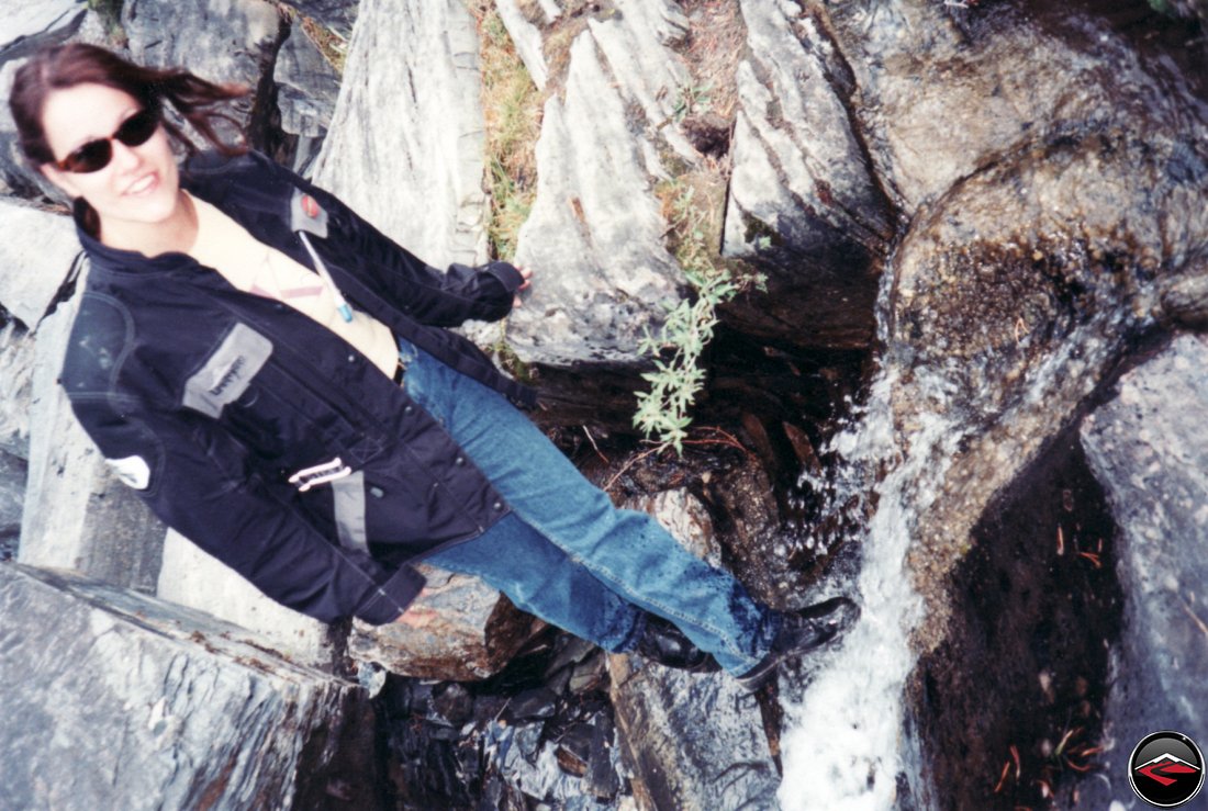 pretty sexy kris dipping her motorcycle boots in the glacier water