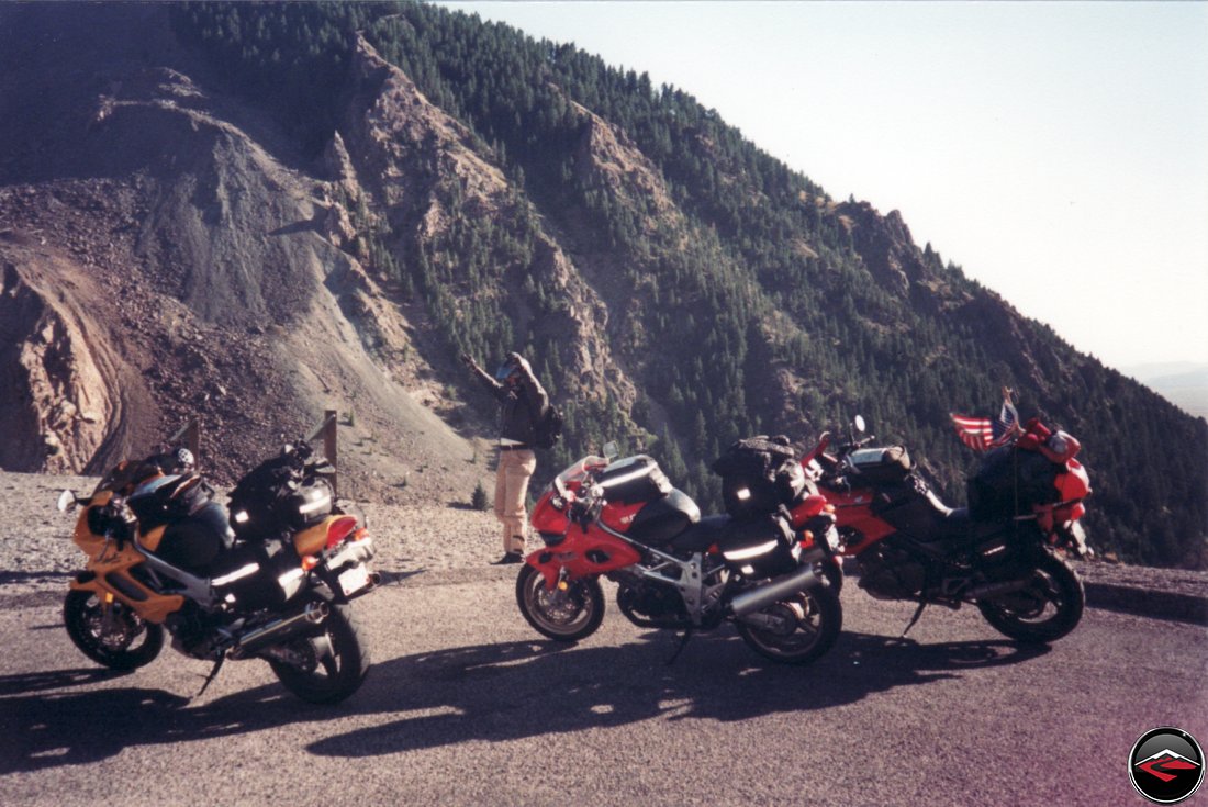 on top of a mountain with Suzuki TL1000S and Honda Superhawk and Yamaha TDM850 motorcycles