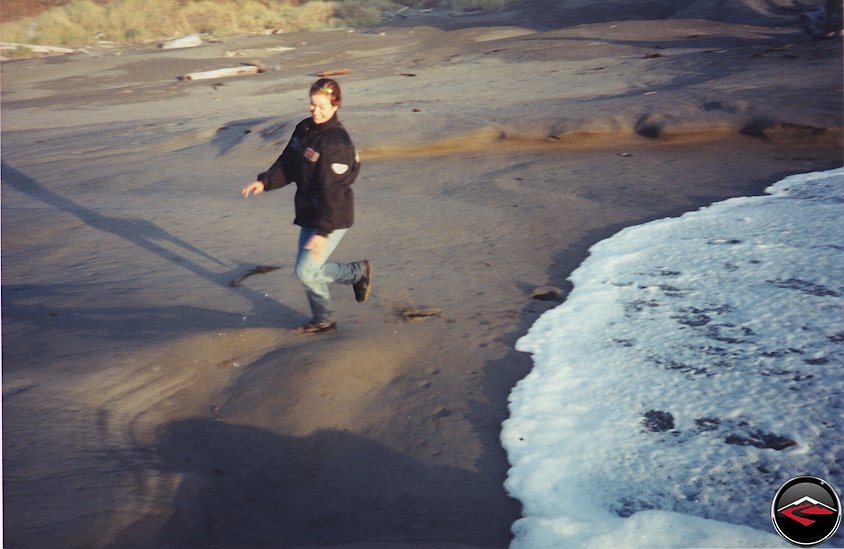 Kris running in the water on the beach