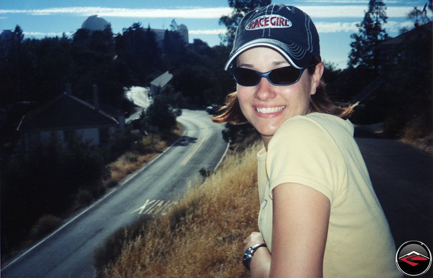 Pretty girl wearing Race Girl Hat standing on Hamilton Mountain near the observatory