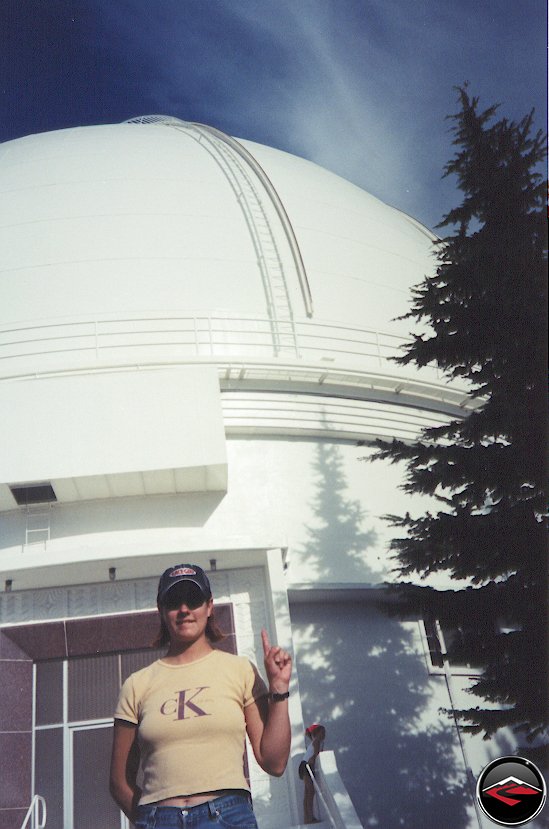 Pretty girl wearing Race Girl Hat standing on Hamilton Mountain near the observatory