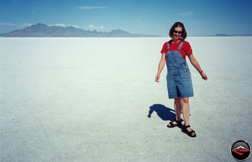 pretty girl standing on the bonneville salt flats