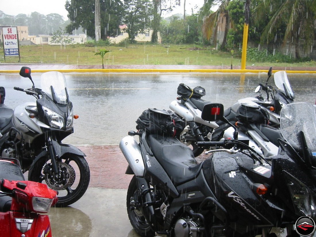 heavy tropical rains fall on suzuki v-strom 650 morocycles