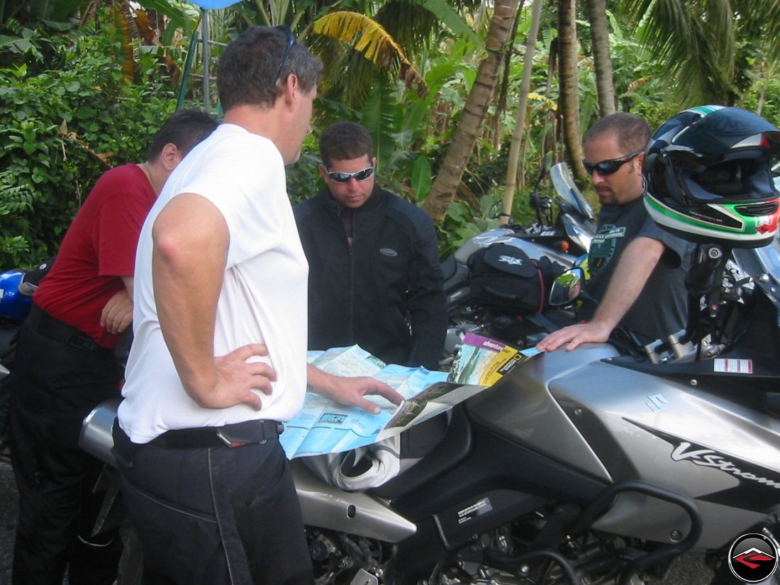 men looking at a map with interst