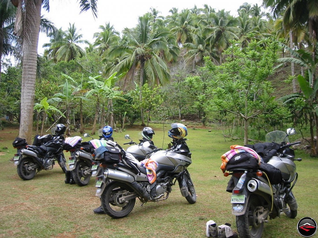 motorcycles parked on the grass in Cascada El Limon Dominican Republic