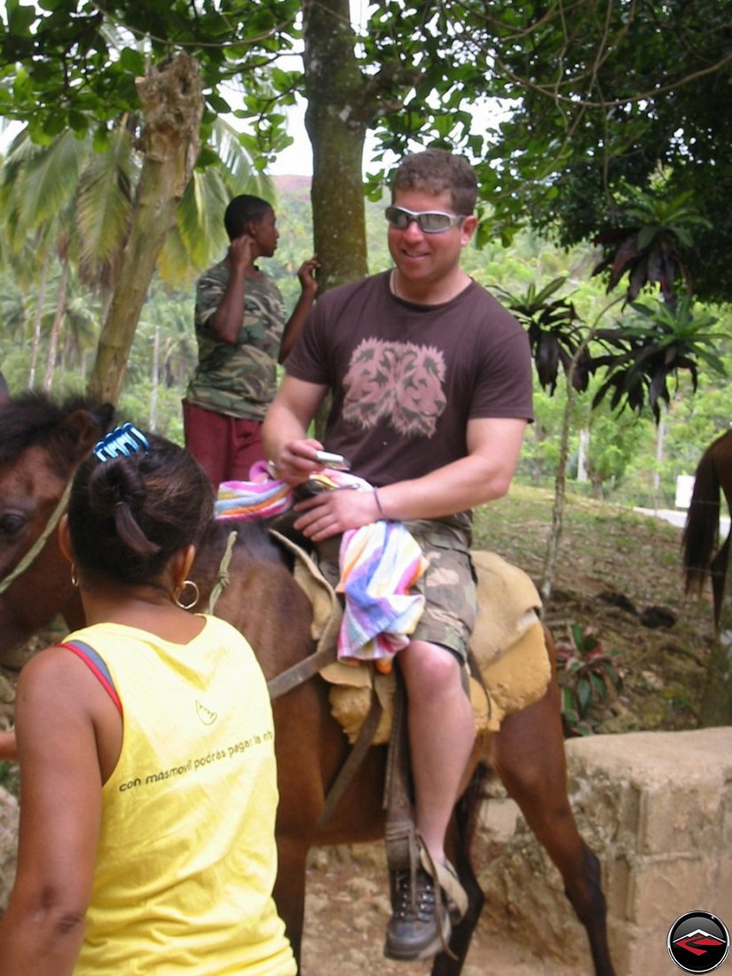 man flirting with local girls in Cascada El Limon Dominican Republic