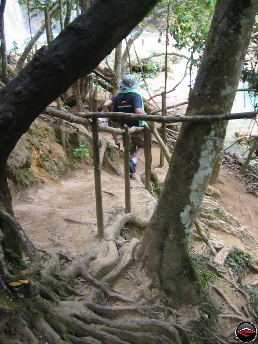 Walking down hand cut stairs to the waterfall at Cascada El Limon Dominican Republic