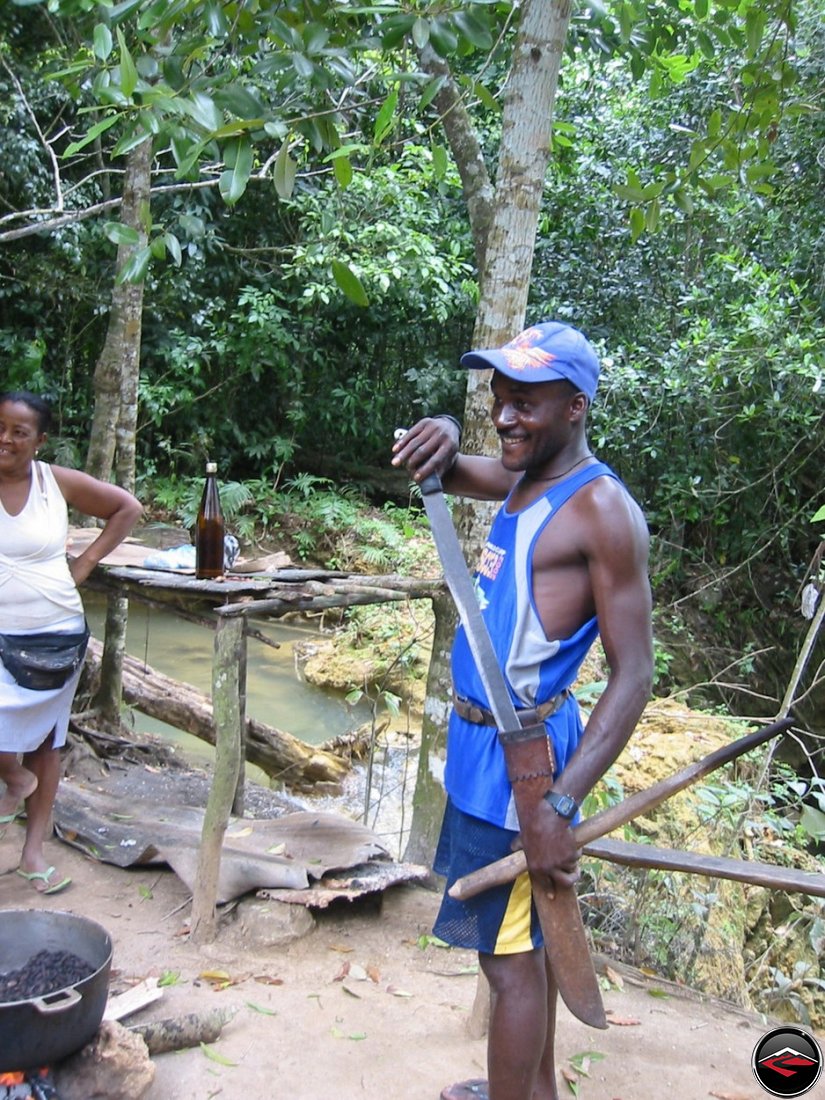 man shows his machete at Cascada El Limon Dominican Republic