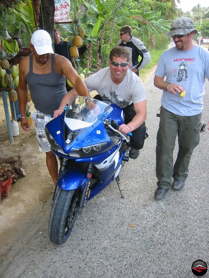 man sitting on a r6 in the dominican republic