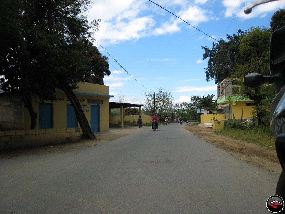 Homes and buisnesses on the side of the road in the caribbean