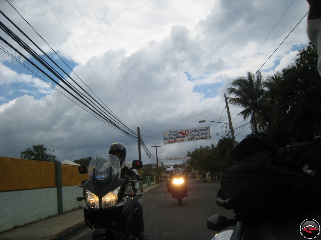 motorcycles ride in the caribbean with dark clouds on the horizon