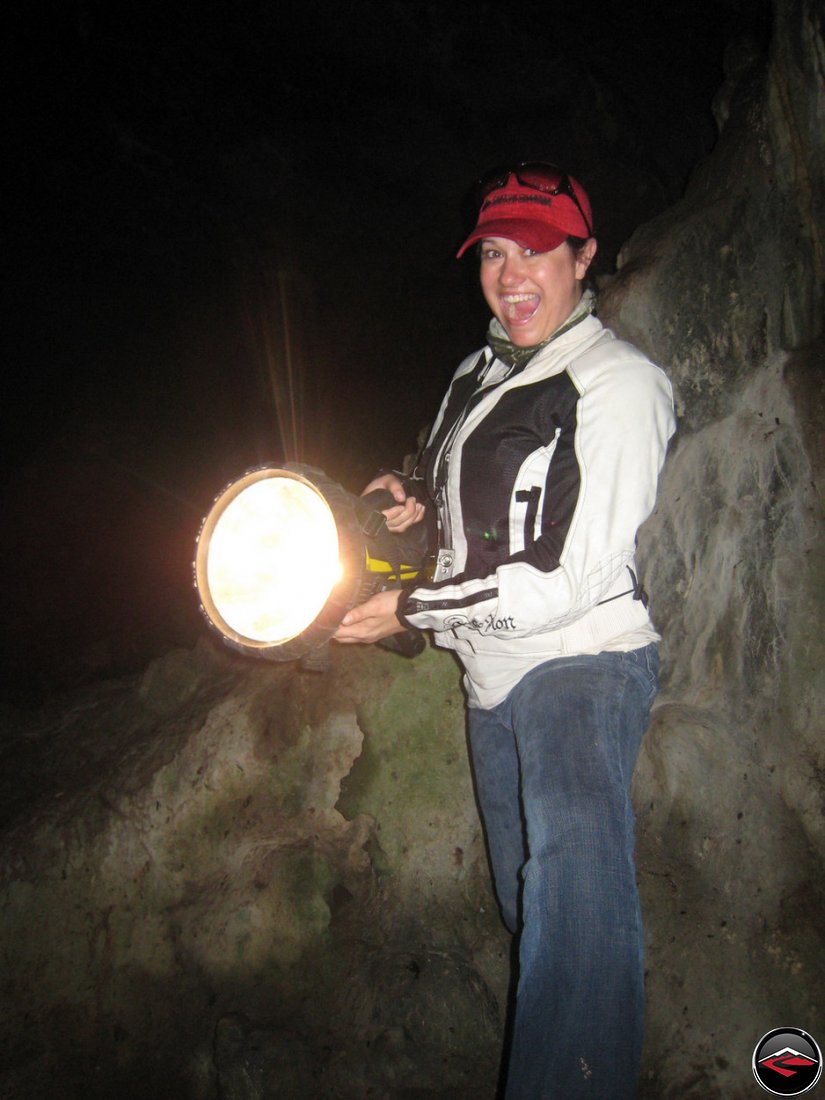 woman holds an enormous flashlight