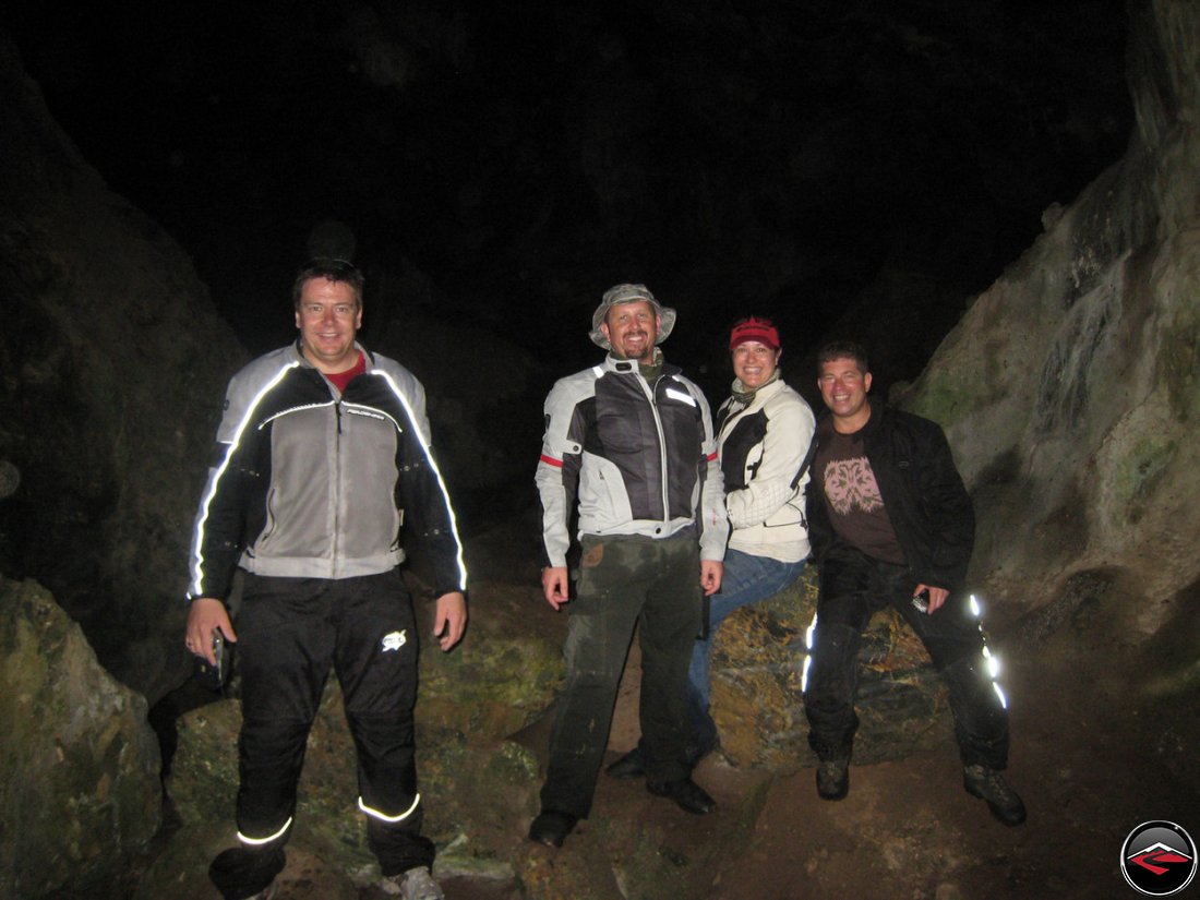 people standing inside a cave