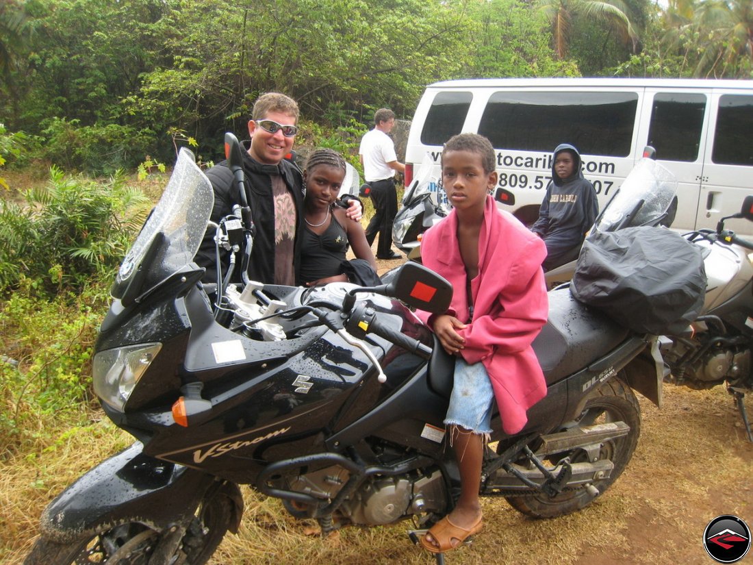 Children sit on motorcycles