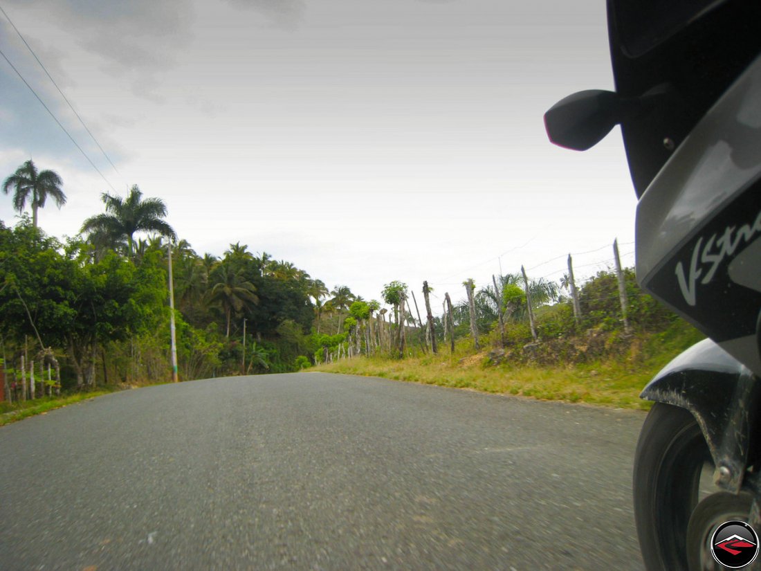 Motorcycle riding down a perfect road in Samana Dominican Republic