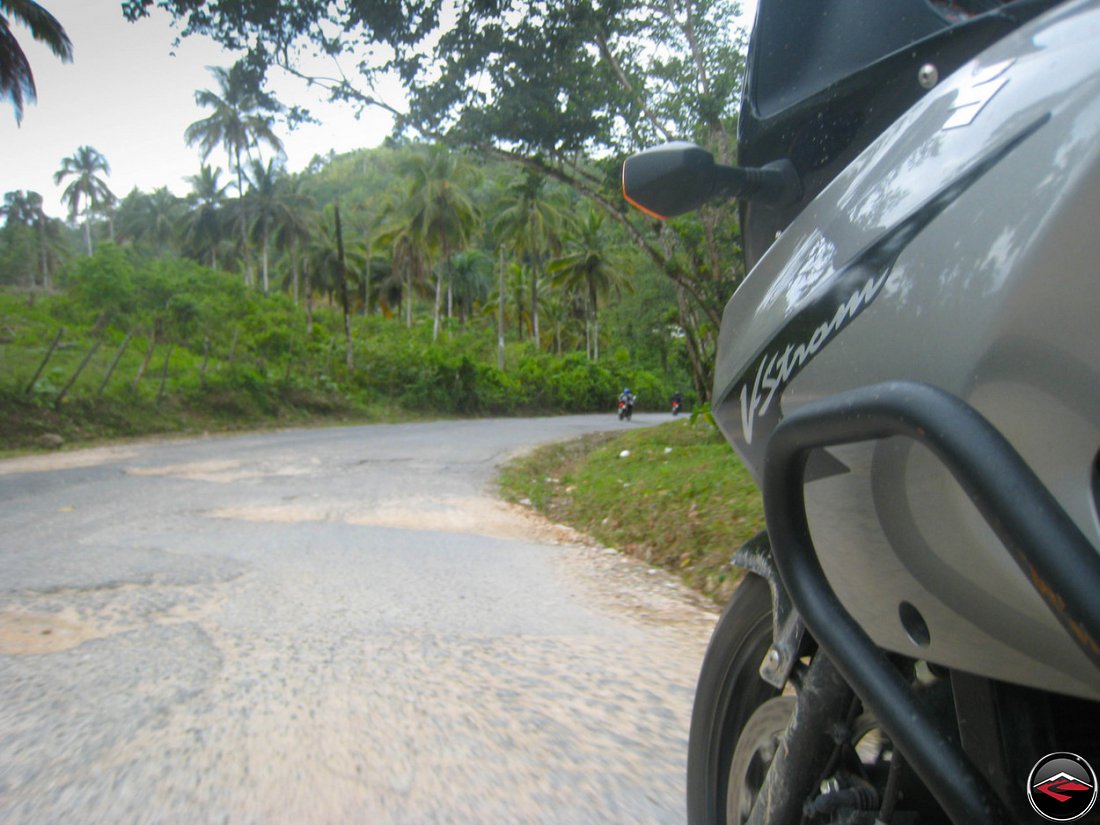 VStrom 650 Motorycle riding through rough asphalt in El Limon Samana Dominican Republic