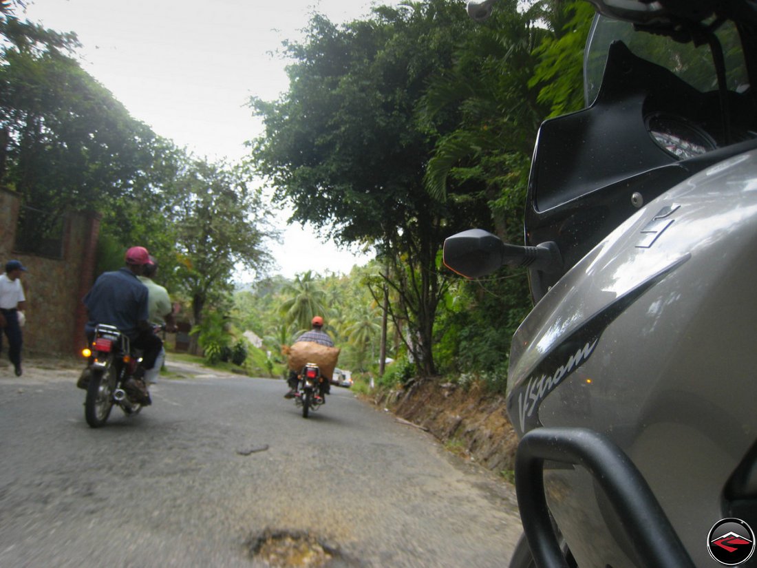 Bikes of burden motorcycles hauling bags of vegetables in El Limon Samana Dominican Republic