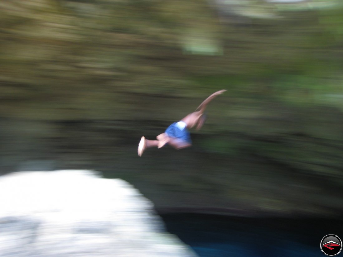 local boy Jumping into water in the dominican republic