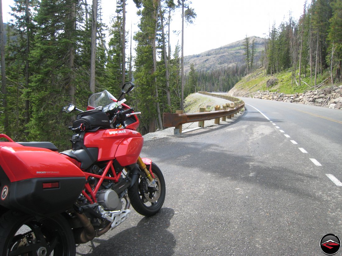 Ducati Multistrada parked on the side of the road in Yellowston National Park