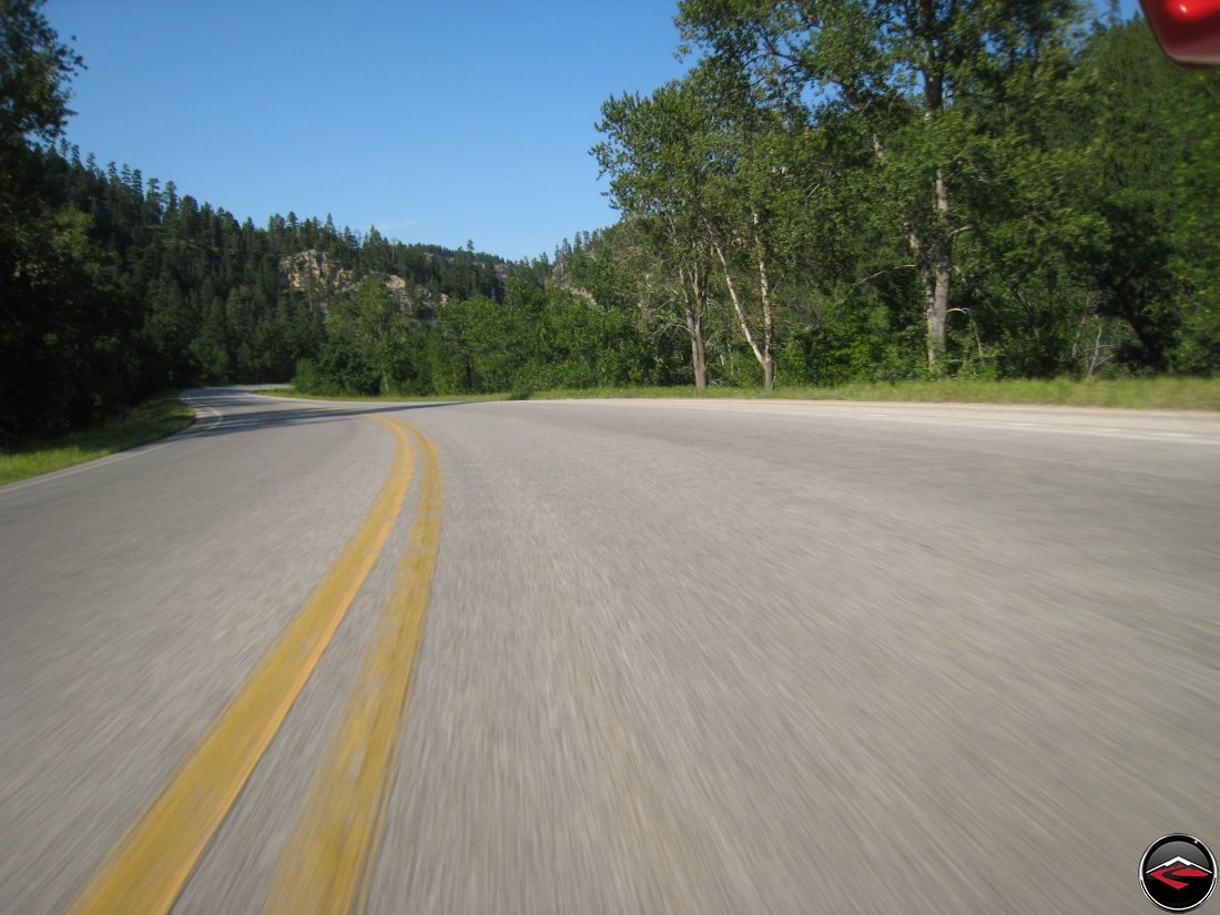 riding a ducati multistrada motorcycle through the black hills of South Dakota