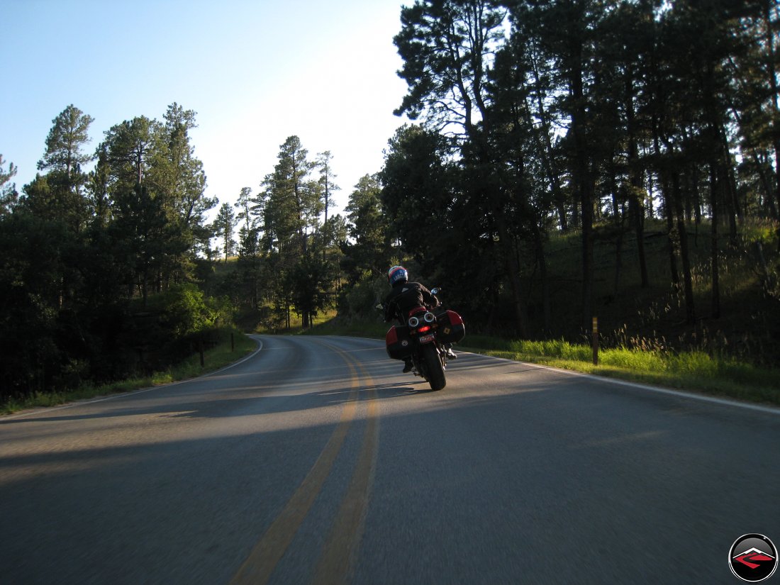 Ducati Multistrada motorcycle riding around Devils Tower at Sunset