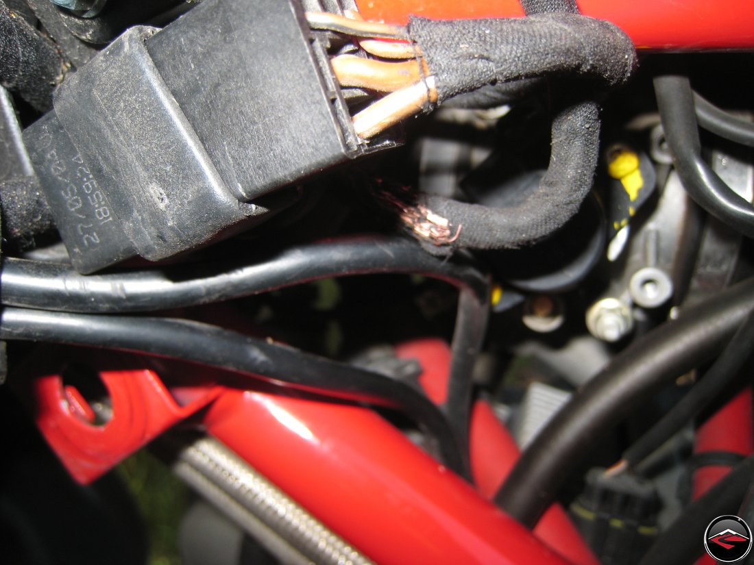Damage to the wiring loom on a motorcycle