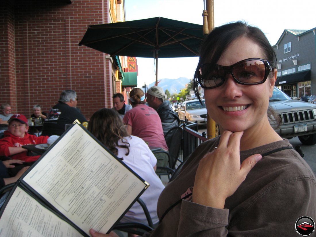 Pretty girl holding a menu in Red Lodge, Montana at the Bridge Creek Country Kitchen and Wine Bar