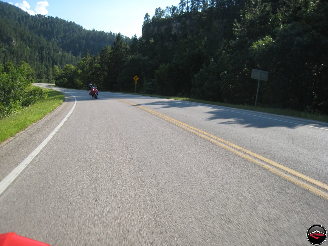 riding a ducati multistrada motorcycle through the black hills of South Dakota