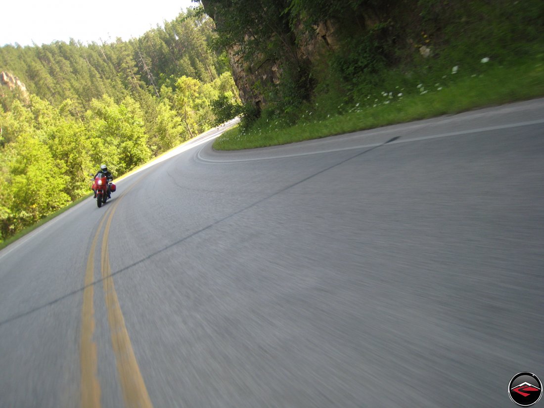 riding a ducati multistrada motorcycle through the black hills of South Dakota