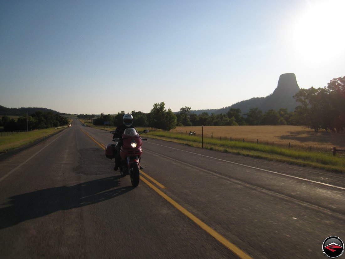 Ducati Multistrada motorcycle riding around Devils Tower at Sunset