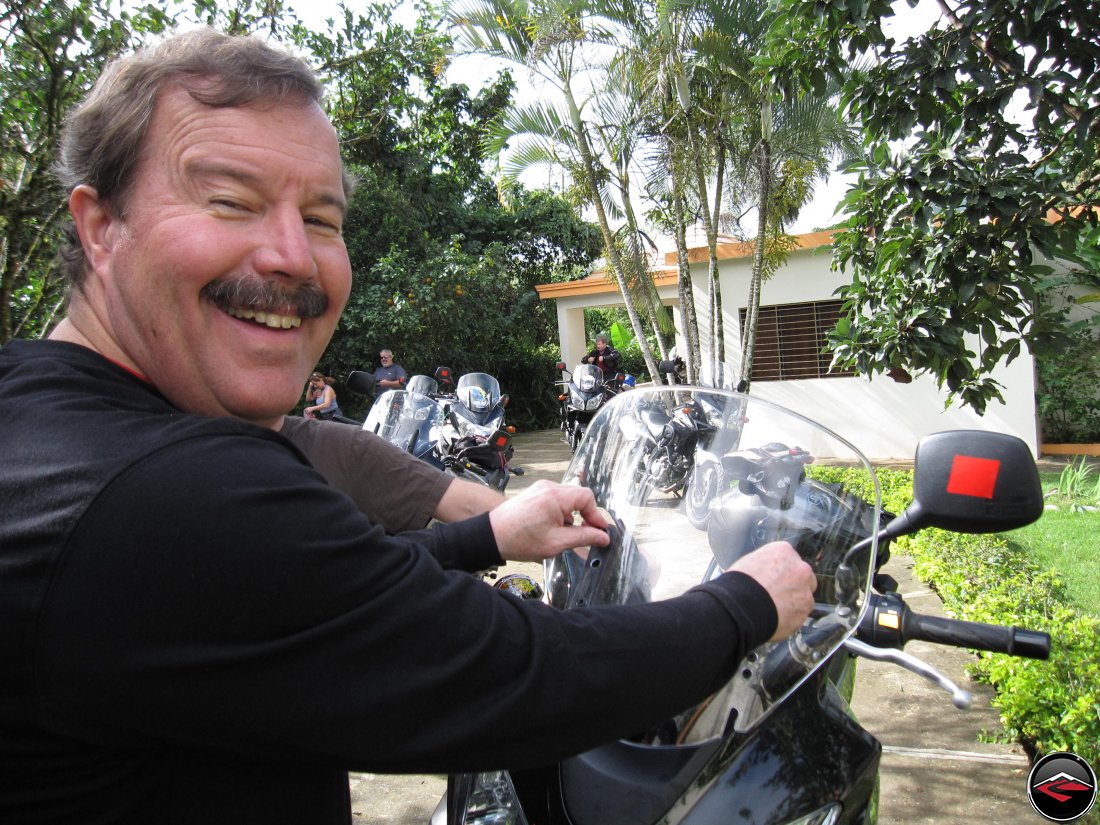 Don lowering the windshield on his Suzuki V-Strom 650