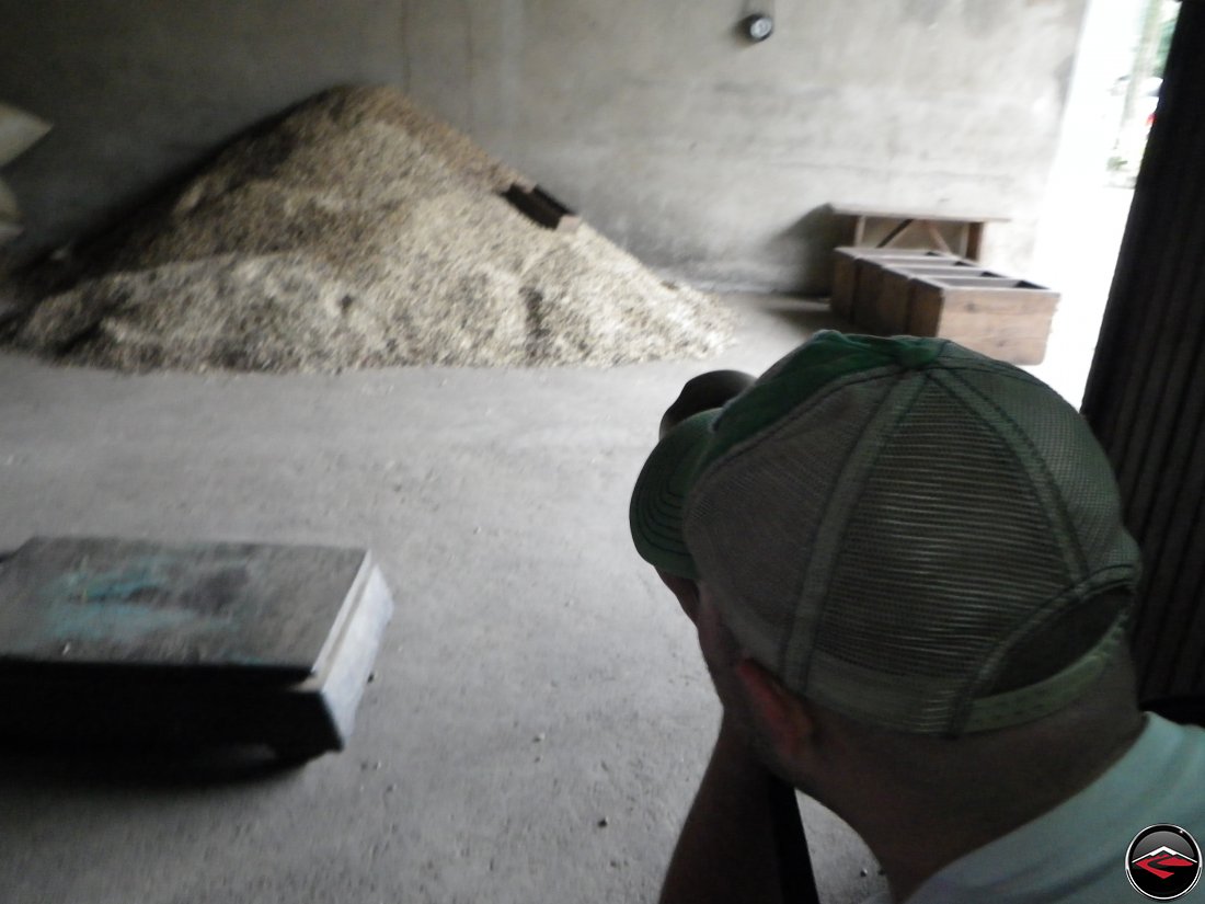 Photo of a Photographer taking a picture of raw coffee beans