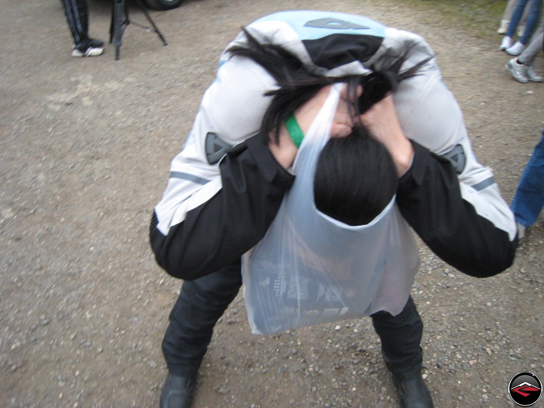 Girl with her head in a shopping bag filled with coffee