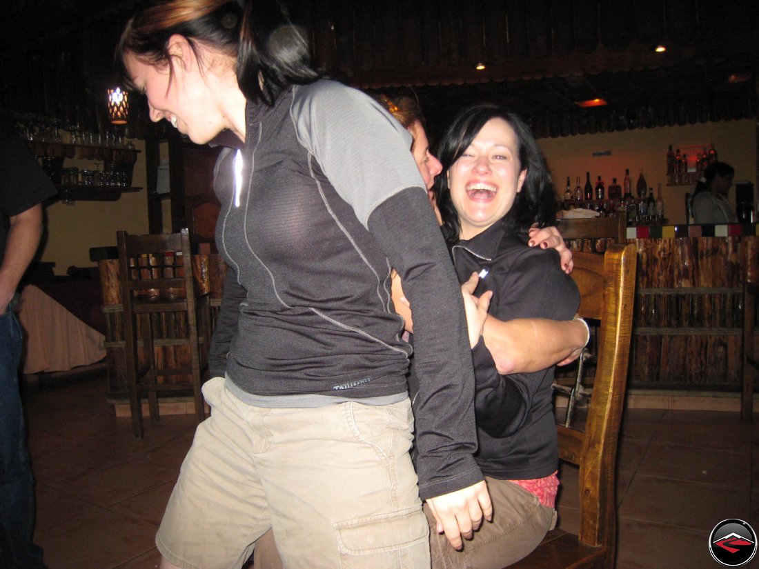 girl giving a lap dance to another girl for her birthday