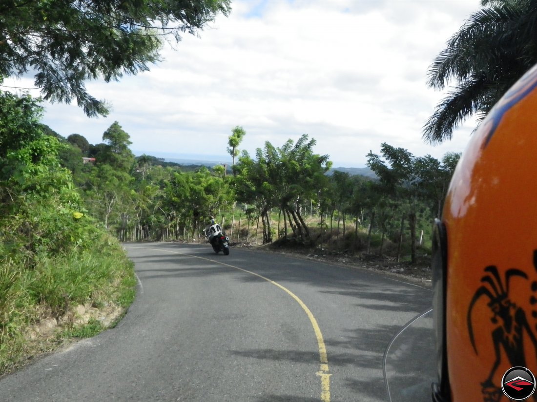 Riding motorcycles along Highway 21 that follows the ridge towards Sabaneta de Yasica Dominican Republic 