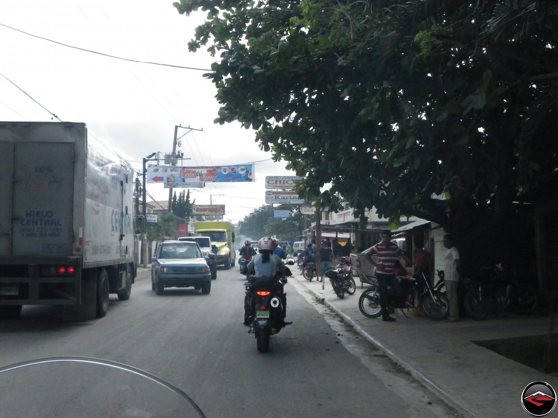 Riding motorcycles through traffic in Sabaneta de Yasica Dominican Republic