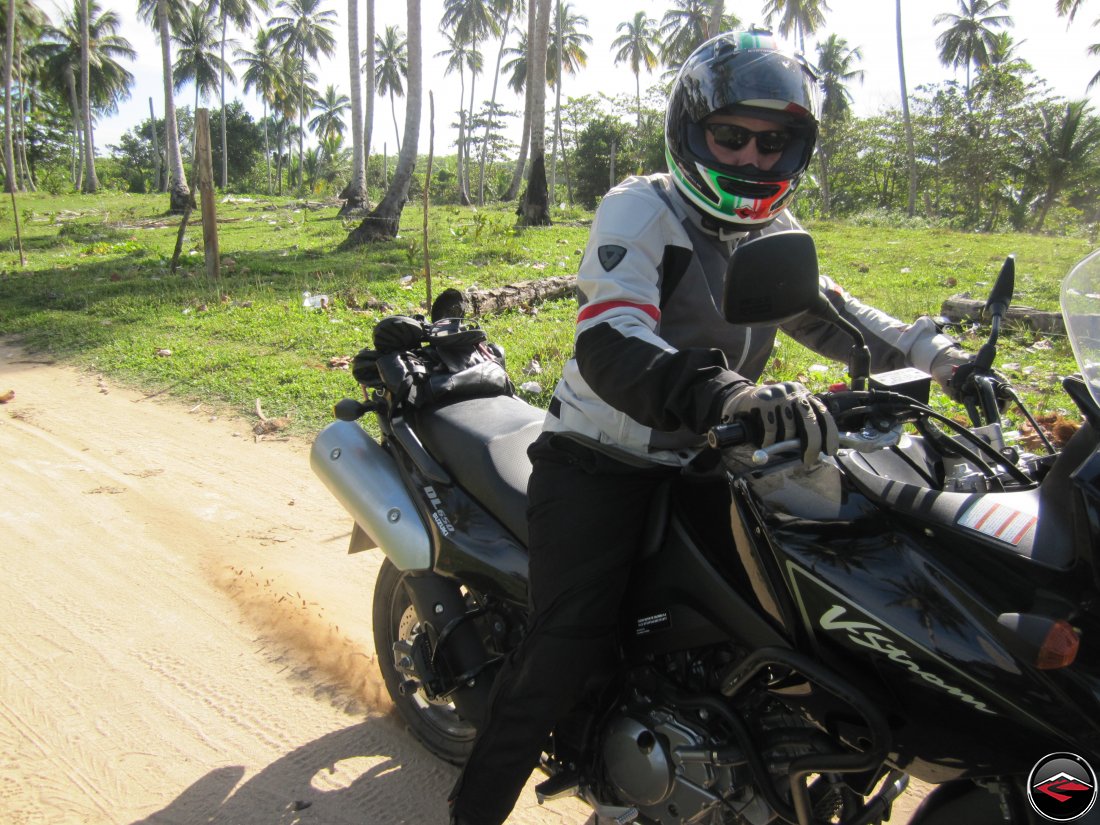 Spinning the rear tire of a motorcycle on a sandy road