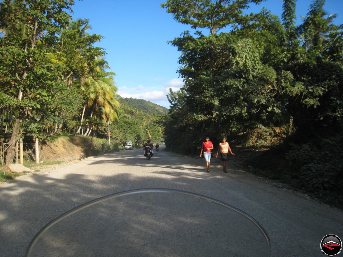 Riding along a road in the dominican republic late in the afternoon