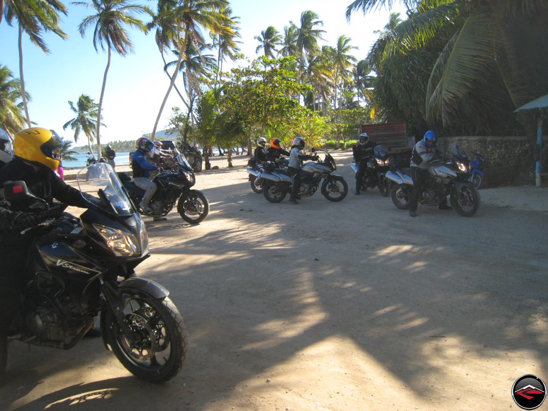 Motorcycles on the beach get ready to go for a group ride