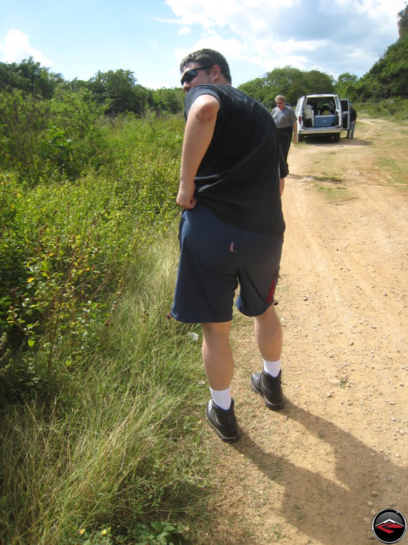 man with a hole in the butt of his shorts