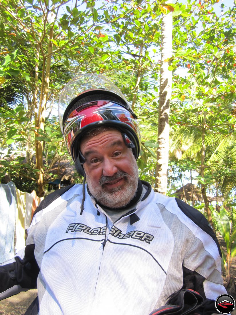 man Playing with his motorcycle helmet