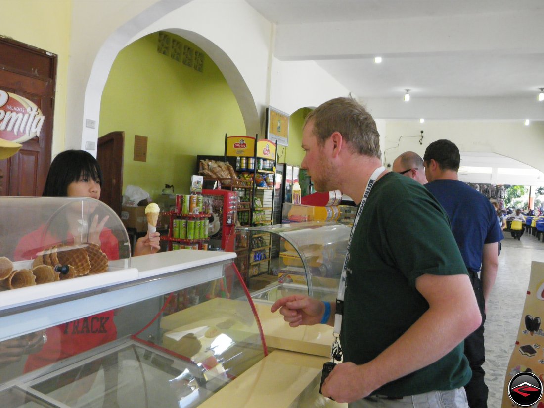 man ordering ice cream at a counter