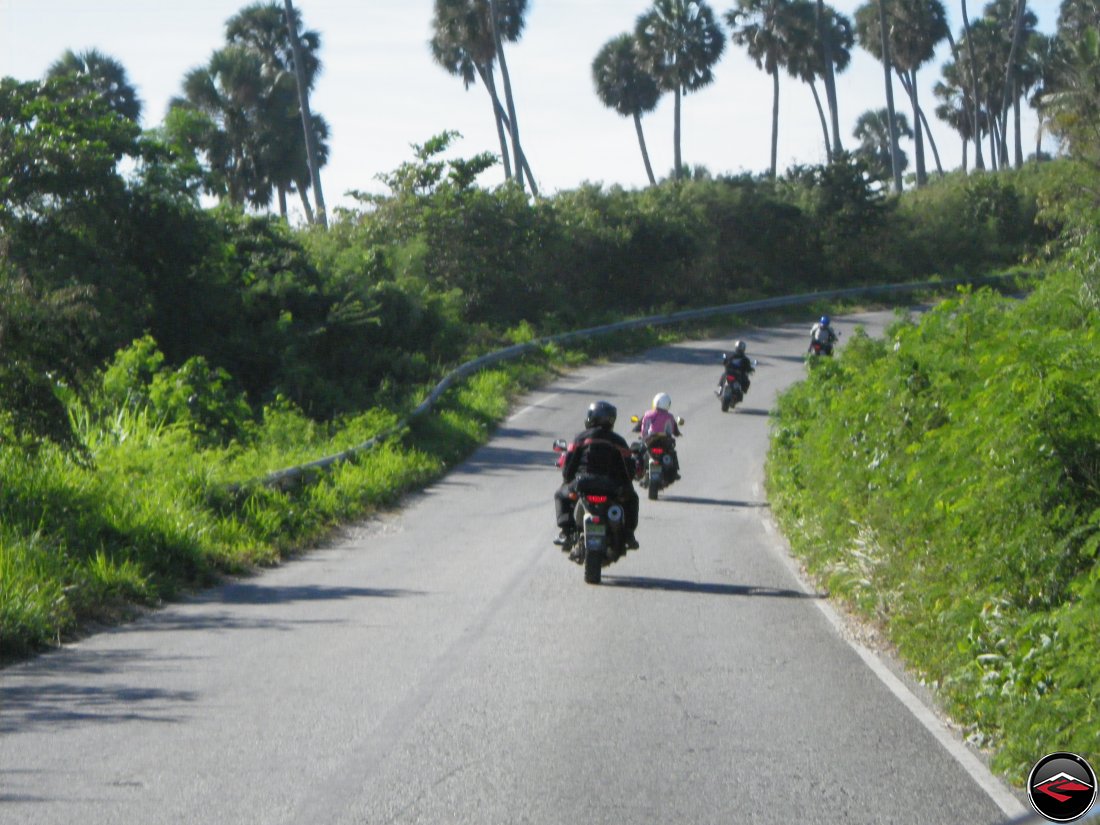 motorcycle riding along the coast line of a caribbean island