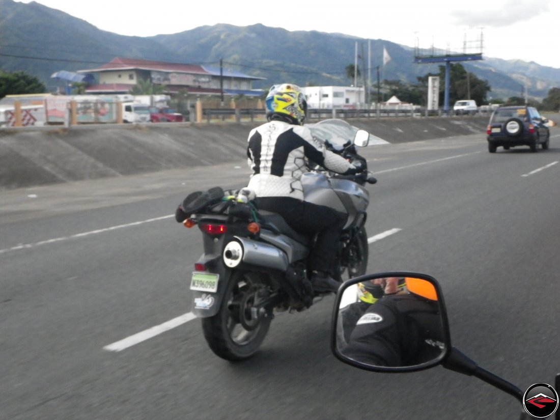 woman riding a motorcycle on the autopista in the dominican republic