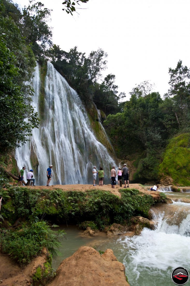 People standing at the bottom of a very Pretty waterfall Cascada El Limon Dominican Republic