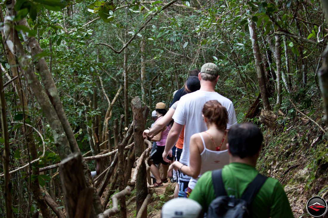 people hiking down to the bottom of the waterfall Cascada El Limon Dominican Republic